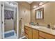 Bathroom with a neutral color palette features a granite vanity and a framed mirror at 109 Mill Creek Dr, Youngsville, NC 27596