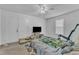 Bedroom with a ceiling fan and closet offers a relaxing retreat at 109 Mill Creek Dr, Youngsville, NC 27596