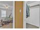 View from the doorway of a bedroom featuring a ceiling fan and a bed and exercise equipment at 109 Mill Creek Dr, Youngsville, NC 27596