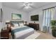 Nicely decorated bedroom with soft rug, ceiling fan, TV, and natural decor and paint at 109 Mill Creek Dr, Youngsville, NC 27596
