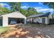 Spacious backyard and garage featuring a blue truck parked inside at 109 Mill Creek Dr, Youngsville, NC 27596