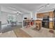 Traditional-style kitchen overlooks a dining area and features wood cabinetry and black appliances at 109 Mill Creek Dr, Youngsville, NC 27596