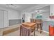 Traditional-style kitchen adjoins a dining area and features wood cabinetry and breakfast bar at 109 Mill Creek Dr, Youngsville, NC 27596