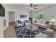 Comfortable living room with stylish seating, a modern rug, and ample natural light at 109 Mill Creek Dr, Youngsville, NC 27596