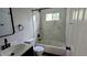 Renovated bathroom with marble-look tile and sleek fixtures at 109 N Dunn St, Angier, NC 27501