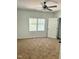 Spacious bedroom featuring a ceiling fan and natural light from windows at 109 N Dunn St, Angier, NC 27501