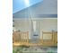 Inviting front porch with wood railings and a freshly painted door offering a warm welcome to the charming home at 109 N Dunn St, Angier, NC 27501