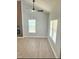 Bright living room featuring vaulted ceilings and large windows at 109 N Dunn St, Angier, NC 27501