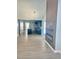 Open-concept living room and kitchen with fireplace and modern lighting at 109 N Dunn St, Angier, NC 27501