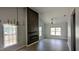 Bright living room with high ceilings, modern fireplace, and large windows at 109 N Dunn St, Angier, NC 27501