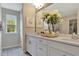 Bright bathroom with double vanity, white cabinets, quartz countertop, and ample storage space at 1204 Sparkling Lake Dr # 20, Apex, NC 27523