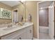 Well-lit bathroom featuring double sinks, modern fixtures, and access to a tiled shower/tub at 1204 Sparkling Lake Dr # 20, Apex, NC 27523