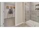 Modern bathroom with a glass-enclosed shower and a walk-in closet for storage at 1204 Sparkling Lake Dr # 20, Apex, NC 27523