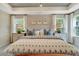 A cozy primary bedroom with stylish decor, tray ceiling, and natural light creates a relaxing retreat at 1204 Sparkling Lake Dr # 20, Apex, NC 27523