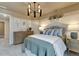 Comfortable bedroom with a large dresser, soft lighting, and simple wall decor at 1204 Sparkling Lake Dr # 20, Apex, NC 27523