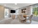 Cozy game room with patterned walls, a large TV, and a view of the outside at 1204 Sparkling Lake Dr # 20, Apex, NC 27523
