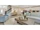 Bright, open-concept living room with modern furnishings and stylish decor, seamlessly connected to the kitchen at 1204 Sparkling Lake Dr # 20, Apex, NC 27523