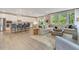 Spacious living room featuring a comfortable sofa, large windows, and an open concept to the kitchen at 1204 Sparkling Lake Dr # 20, Apex, NC 27523