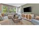 Cozy living room with a large sectional sofa, stylish decor, and ample natural light at 1204 Sparkling Lake Dr # 20, Apex, NC 27523