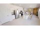 Bright kitchen featuring white cabinets, granite counters, stainless steel appliances, and an island with bar seating at 1209 Solace Way, Rolesville, NC 27571