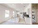 Open-concept kitchen features white cabinets, granite counters, stainless appliances, and island with seating at 1209 Solace Way, Rolesville, NC 27571