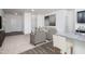 Open-concept living space with plush seating, neutral tones, and seamless flow to the kitchen at 1209 Solace Way, Rolesville, NC 27571