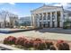 Classic Raleigh Memorial Auditorium featuring iconic columns and beautiful landscaping in a vibrant city setting at 1250 Coach Station Aly # 201, Raleigh, NC 27601