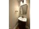 Small but efficient bathroom features a stylish vanity and modern lighting fixture at 1316 Plunket Dr, Wake Forest, NC 27587