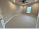 Well-lit room featuring plush carpeting, a ceiling fan, and neutral wall colors at 1316 Plunket Dr, Wake Forest, NC 27587