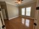 Neutral bedroom with crown molding, a ceiling fan, and natural light from two windows at 1316 Plunket Dr, Wake Forest, NC 27587