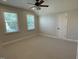 Comfortable bedroom with neutral colors, wall-to-wall carpeting, and a ceiling fan at 1316 Plunket Dr, Wake Forest, NC 27587
