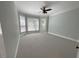Spacious bonus room featuring a ceiling fan, neutral walls, and natural light at 1316 Plunket Dr, Wake Forest, NC 27587