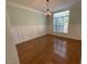 Bright dining room featuring decorative molding, hardwood floors, and a large window at 1316 Plunket Dr, Wake Forest, NC 27587