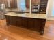 Kitchen featuring a large island, stainless steel appliances, granite countertops, and hardwood floors at 1316 Plunket Dr, Wake Forest, NC 27587