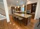 Spacious kitchen with a large center island with seating and stainless steel appliances at 1316 Plunket Dr, Wake Forest, NC 27587