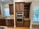 Kitchen featuring stainless steel appliances, granite countertops, and dark wood cabinetry at 1316 Plunket Dr, Wake Forest, NC 27587
