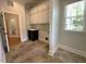 Laundry room featuring ample cabinet space, tile flooring and natural lighting at 1316 Plunket Dr, Wake Forest, NC 27587