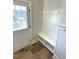 The mudroom features a built-in bench with hooks and an exterior door for convenience at 1316 Plunket Dr, Wake Forest, NC 27587