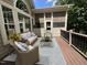 Inviting screened porch with comfortable wicker seating, a stylish rug, and views of the natural landscape at 1316 Plunket Dr, Wake Forest, NC 27587