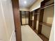 Well-organized walk-in closet featuring custom wood shelving and ample storage space at 1316 Plunket Dr, Wake Forest, NC 27587