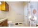 Bathroom with granite countertops, tile floors, and shower at 1401 Burchcrest Dr, Garner, NC 27529
