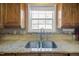 Kitchen sink with granite countertops and cabinetry at 1401 Burchcrest Dr, Garner, NC 27529
