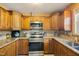 Updated kitchen with stainless steel appliances, granite countertops, and ample cabinet space at 1401 Burchcrest Dr, Garner, NC 27529