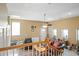 Spacious living room with leather furniture, ceiling fan and natural light at 1401 Burchcrest Dr, Garner, NC 27529