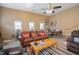 Comfortable living room featuring a sofa, area rug, and a neutral color scheme at 1401 Burchcrest Dr, Garner, NC 27529