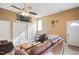 Inviting living room with a ceiling fan, cozy seating, and natural light at 1401 Burchcrest Dr, Garner, NC 27529