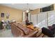 Open-concept living room with stylish furniture, a ceiling fan and tiled floors at 1401 Burchcrest Dr, Garner, NC 27529