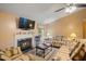 Cozy living room featuring a fireplace, hardwood floors, plush seating, and lots of natural light at 1401 Burchcrest Dr, Garner, NC 27529