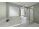 Luxurious bathroom featuring a separate shower and tub, enhancing relaxation and convenience at 158 Arlie Ln, Lillington, NC 27546