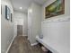 Hallway with bench, hooks, art and decorative touches leading to other rooms at 158 Arlie Ln, Lillington, NC 27546